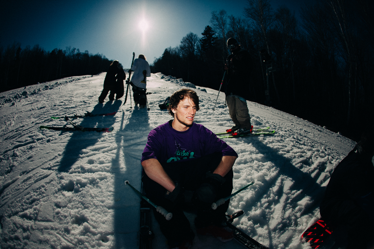 Tyler Duncan sits in snow at a photoshoot at Mount Snow's Carinthia Park in Vermont