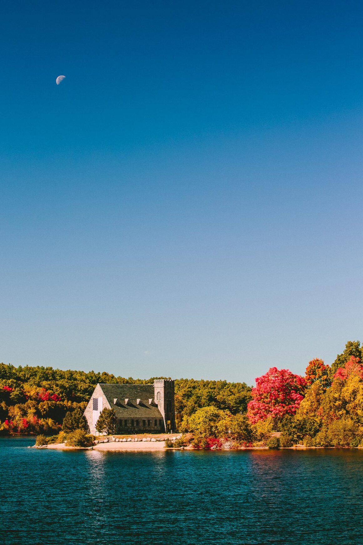 The Old Stone Church along the shore of the Wachusett Reservoir with Fall Foliage